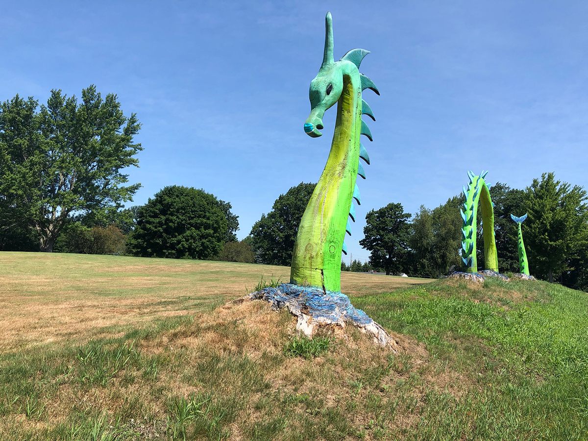 Carved from wood by artist James Link, "Cecil" resides at The Club at Silver Lake. The beloved sculpture is one of several sea serpent likenesses around Perry, New York.