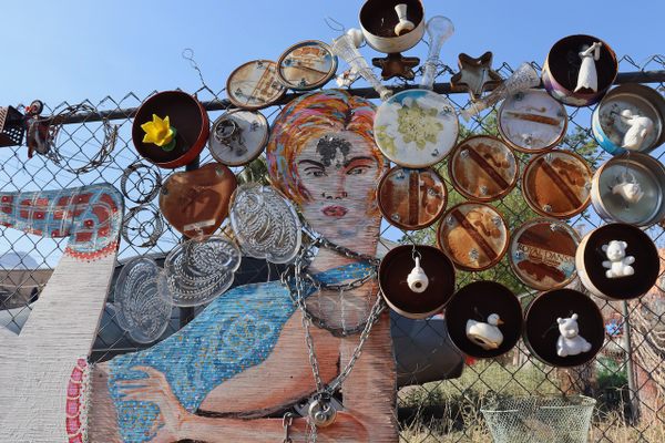 A Ziggy Stardust-esque figure presides over the installation.