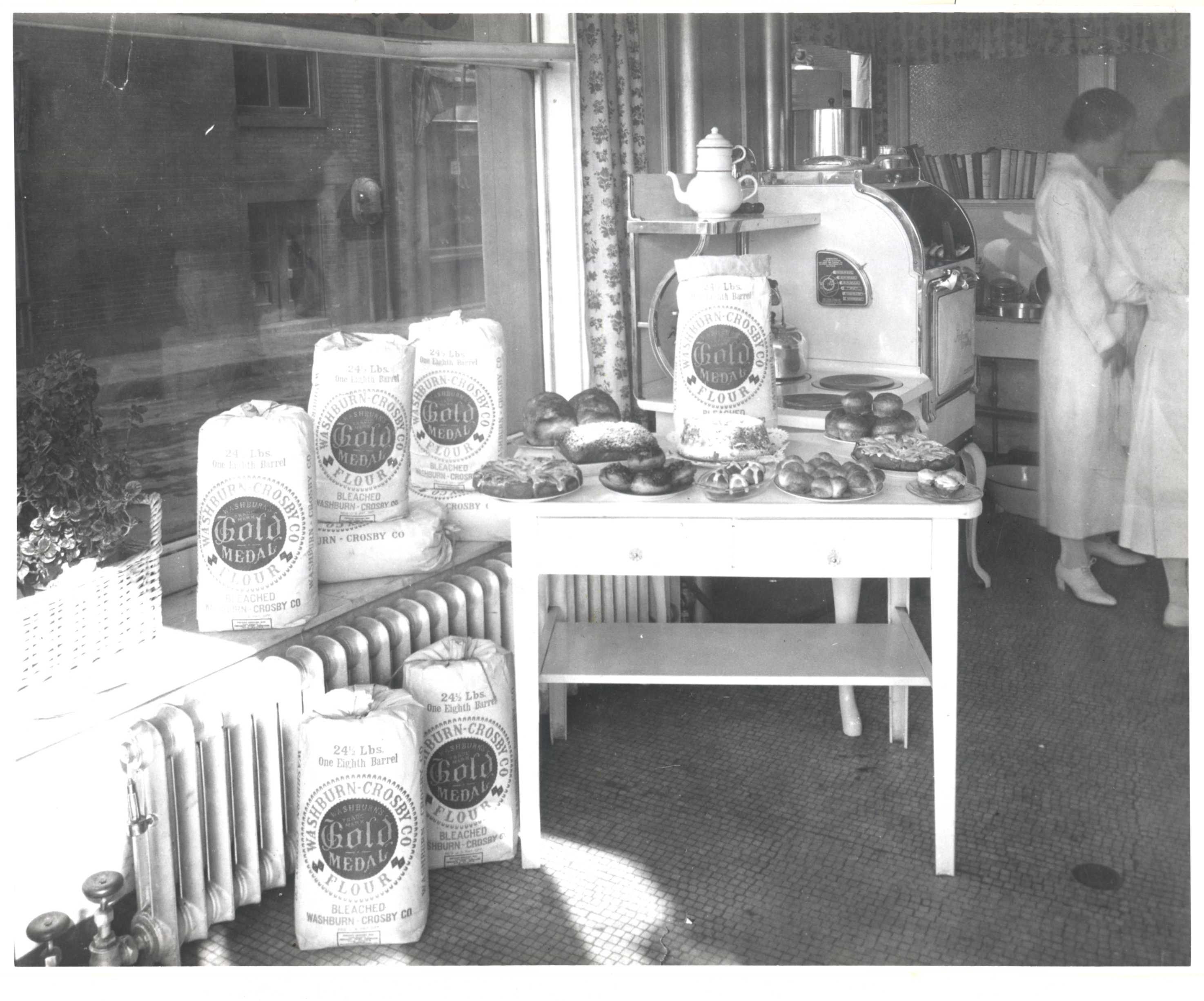 In this 1924 picture, bags of Gold Medal flour fill one early test kitchen.