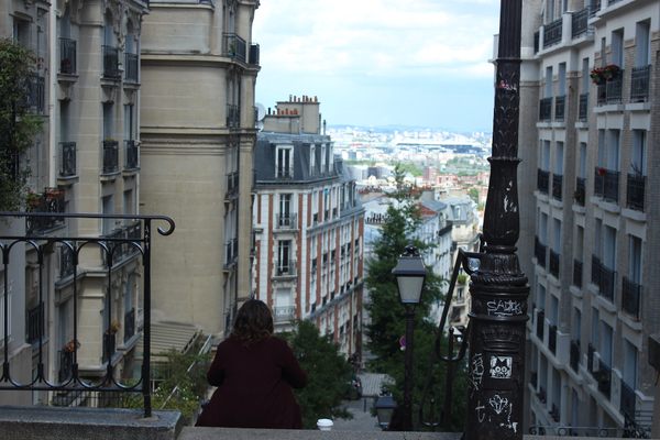 A woman enjoying the sights of a new city alone.