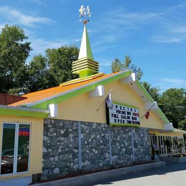 The orange roof is still shining, with the iconic weathervane standing tall.