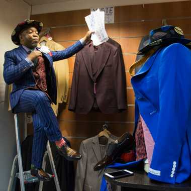 Le Bachelor takes a break while arranging new merchandise at Sape &amp; Co